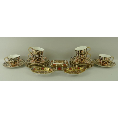 512 - A Royal Crown Derby part teaset, decorated in gilt-heightened Imari palate, comprising six tea cups,... 