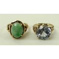 An 18ct gold and jade ring, the decorative claw mount set with oval apple green jade, size L, 5.2g t... 