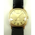 A gentleman's vintage 9ct gold Tudor wristwatch, with baton numerals to the gold coloured face, on a... 