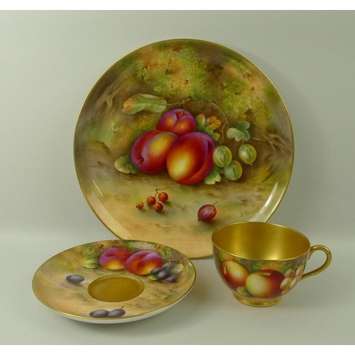 503 - A Royal Worcester cabinet plate, decorated with plums and gooseberries, 23cm, and a tea cup and sauc... 