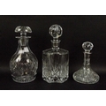 A group of three decanters, comprising a Tudor Crystal cut glass decanter, a hexagonal cut glass dec... 