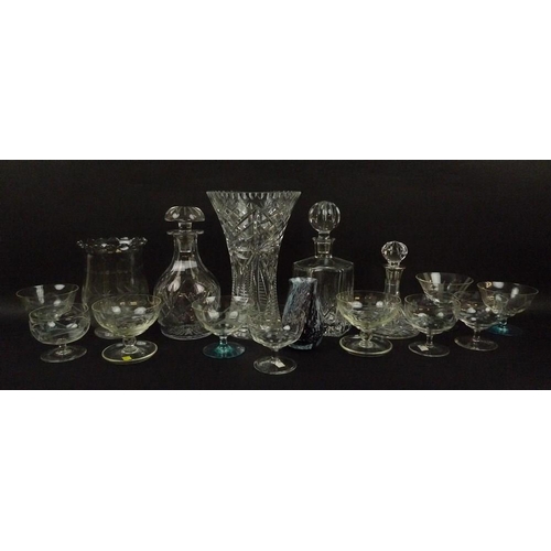 511 - A group of three decanters, comprising a Tudor Crystal cut glass decanter, a hexagonal cut glass dec... 