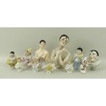 A collection of ten porcelain half doll pin cushions, 19th and early 20th century, including three p... 
