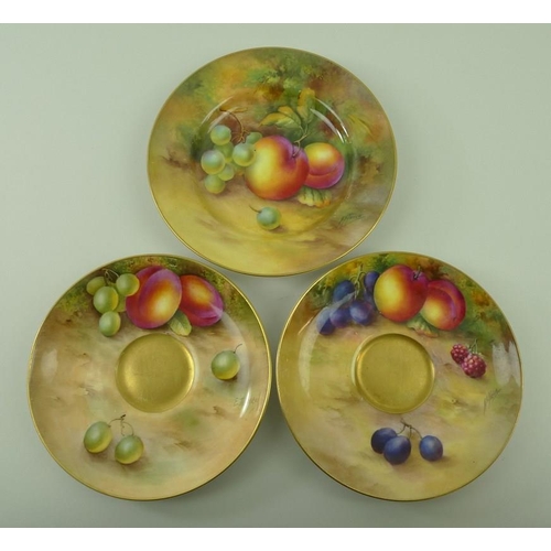 528 - A Royal Worcester trio comprising tea cup, saucer and plate, painted with plums, raspberries and gra... 