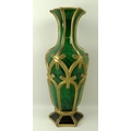 A Bohemian green glass vase, 19th century, with spiral mottled body, gilded, moulded and beaded latt... 