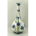 A Moorcroft Macintyre Florian ware porcelain bottle vase, circa 1903, in the 'Blue Poppy' pattern, p... 