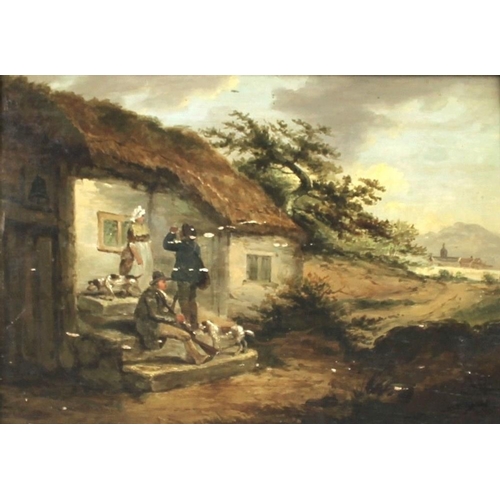 594A - Attributed to George Morland (British, 1763-1804): a country cottage with three figures and two dogs... 