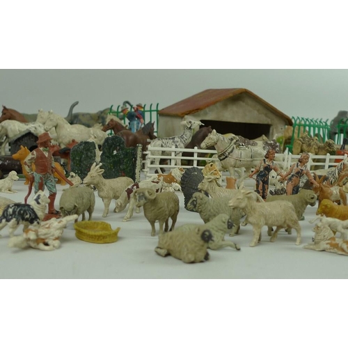 642 - A collection of 1950's Britains farm yard animals and exotic zoo animals mostly plastic with some le... 