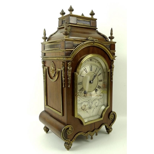 651 - A Victorian mahogany cased mantel clock, silvered dial with black Roman numerals, twin train WBK & F... 