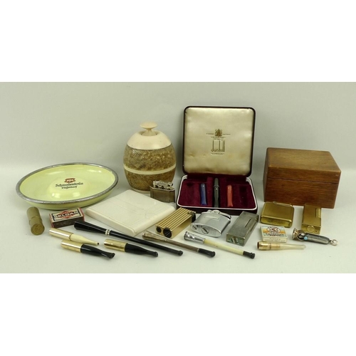 653A - A collection of vintage smoking collectables, comprising a cased part set of Dunhill cheroot holders... 