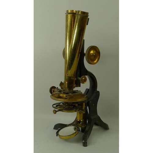 654A - A brass and black enamelled binocular compound microscope, by Swift & Son, London, with a lacquered ... 