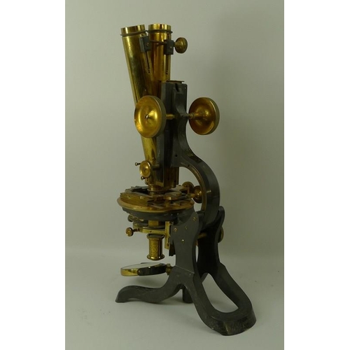 654A - A brass and black enamelled binocular compound microscope, by Swift & Son, London, with a lacquered ... 