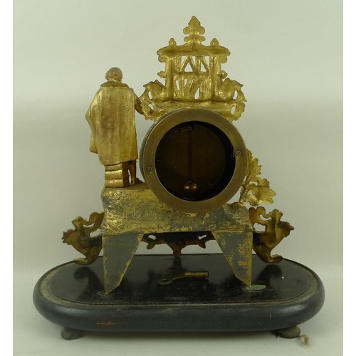 655 - A French gilt spelter figural mantel clock modelled as Shakespeare in his library, standing on a ope... 