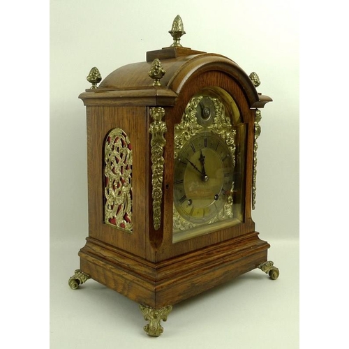 656 - An oak cased mantel clock, 19th century, W&H and Sons, of architectural form, the domed top above br... 