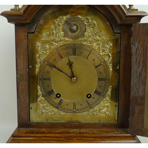 656 - An oak cased mantel clock, 19th century, W&H and Sons, of architectural form, the domed top above br... 