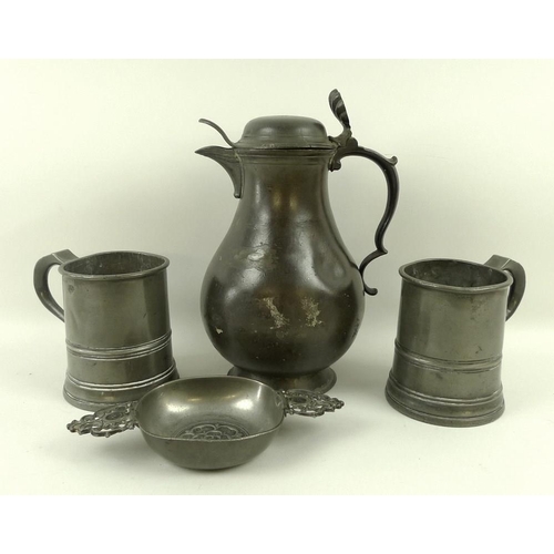 659 - A pewter ale jug of pear form, early 18th century, with broken rococo scroll handle, shell thumbpiec... 