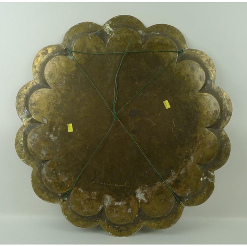 660 - An Indian brass lobed tray, intricately engraved, 57cm.