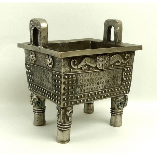 660A - A Chinese censer, Fang Ding style, silvered bronze of rectangular slab form, cast with twin loop han... 