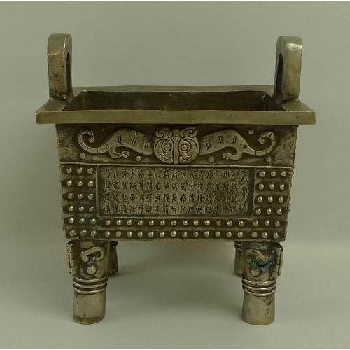 660A - A Chinese censer, Fang Ding style, silvered bronze of rectangular slab form, cast with twin loop han... 