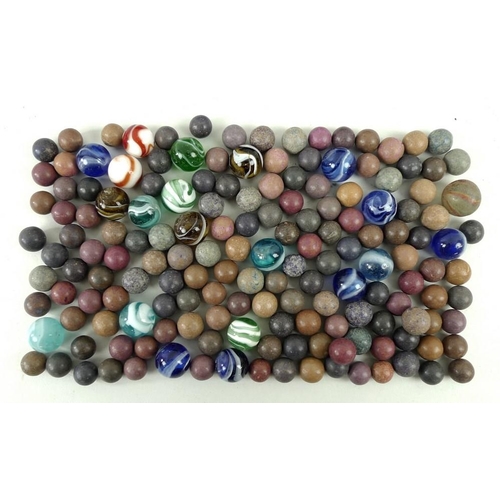 683A - A collection of vintage marbles, comprising twenty-one coloured glass marbles, various swirl designs... 