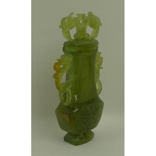 686 - A Chinese jade carved lidded urn, circa 1930's, with dolphin head finials, and ring handles, 14cm, b... 