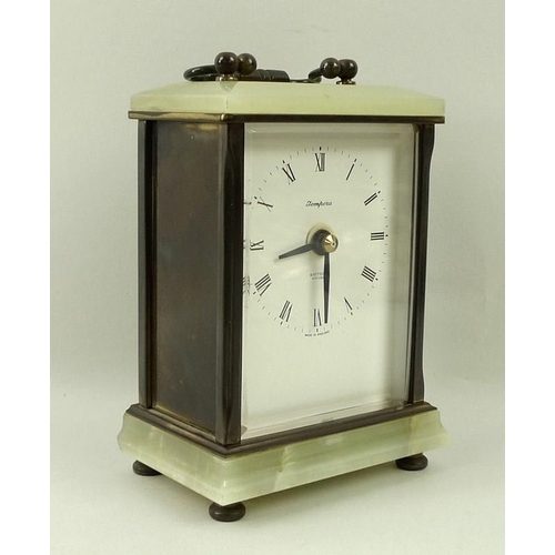 690A - A Tempora carriage clock, with onyx base and top, with three metal side, carrying handle, and four f... 