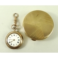 A 9ct gold pill box, 18.3g, and a lady's 9ct gold cased pocket watch, the enamel dial with Roman num... 