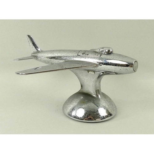 694A - A Dunhill novelty electroplated table lighter, circa 1950, in the form of a jet aeroplane, on a dome... 