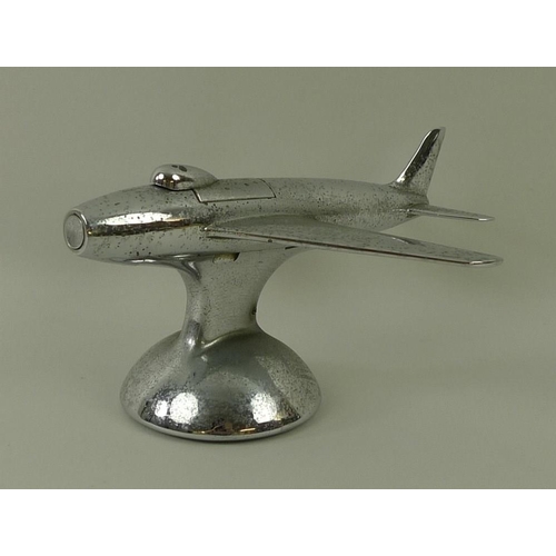 694A - A Dunhill novelty electroplated table lighter, circa 1950, in the form of a jet aeroplane, on a dome... 