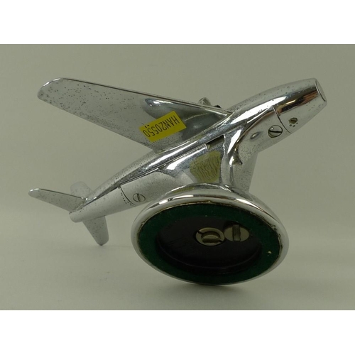 694A - A Dunhill novelty electroplated table lighter, circa 1950, in the form of a jet aeroplane, on a dome... 