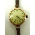 A 9ct gold lady's wristwatch, the circular face with Arabic numerals and subsidiary dial, marked Lou... 