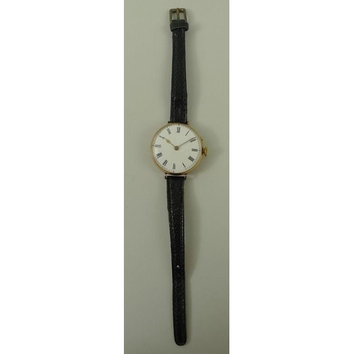 698 - A Swiss 14K gold lady's wristwatch, circa 1916, circular 28mm dial with black Roman numerals, keyles... 