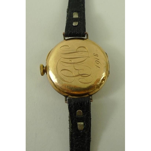 698 - A Swiss 14K gold lady's wristwatch, circa 1916, circular 28mm dial with black Roman numerals, keyles... 