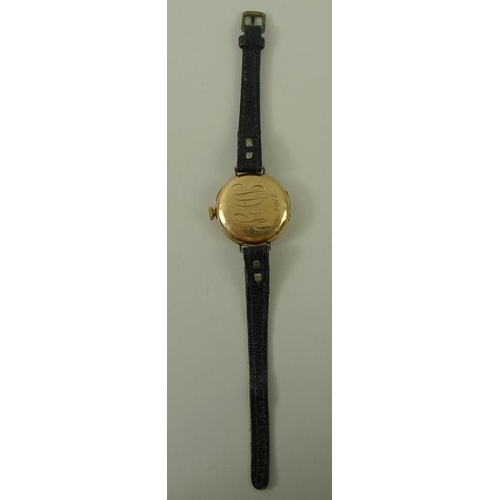 698 - A Swiss 14K gold lady's wristwatch, circa 1916, circular 28mm dial with black Roman numerals, keyles... 