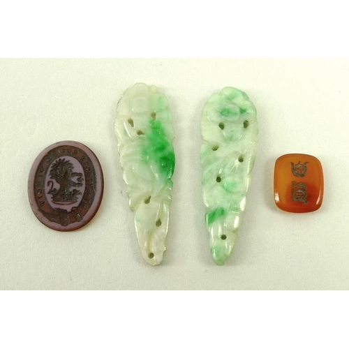 714 - A pair of jade carved and pierced drops, an unmounted intaglio with coronet and lion, and an agate s... 