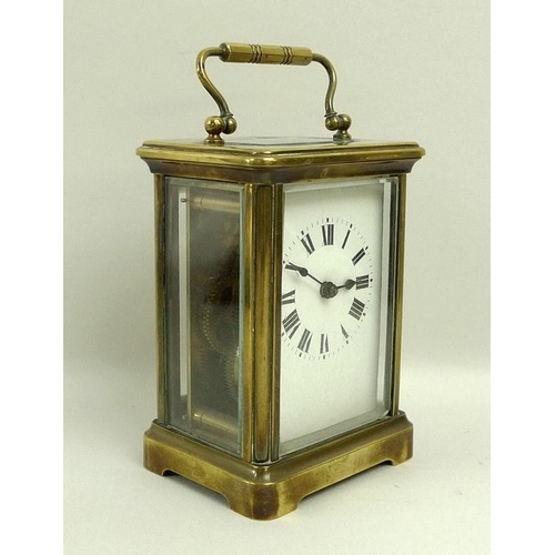 718A - A French brass carriage clock, early 20th century, white dial with black Roman numerals, 8 by 6.5 by... 