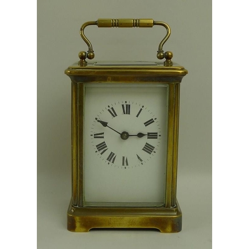 718A - A French brass carriage clock, early 20th century, white dial with black Roman numerals, 8 by 6.5 by... 