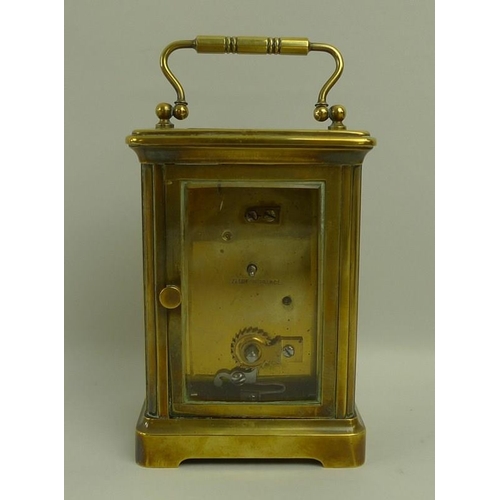 718A - A French brass carriage clock, early 20th century, white dial with black Roman numerals, 8 by 6.5 by... 