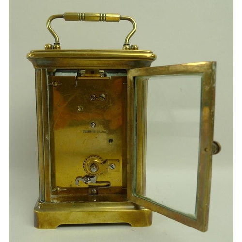 718A - A French brass carriage clock, early 20th century, white dial with black Roman numerals, 8 by 6.5 by... 