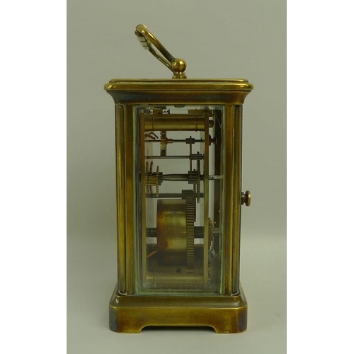 718A - A French brass carriage clock, early 20th century, white dial with black Roman numerals, 8 by 6.5 by... 