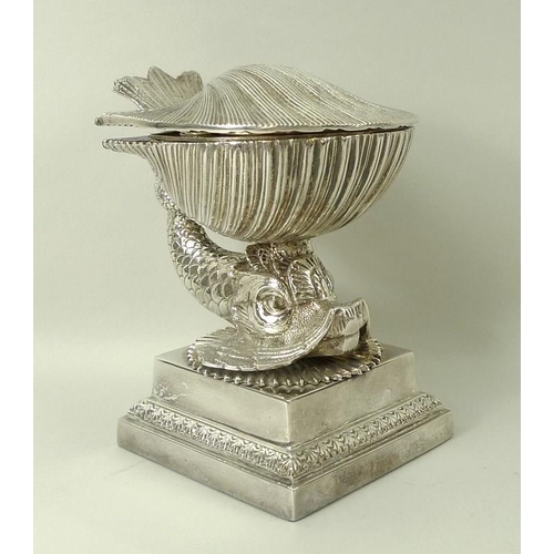 728 - An Italian silver plated desk set, 20th century, modelled as a dolphin supporting a shell with a hin... 