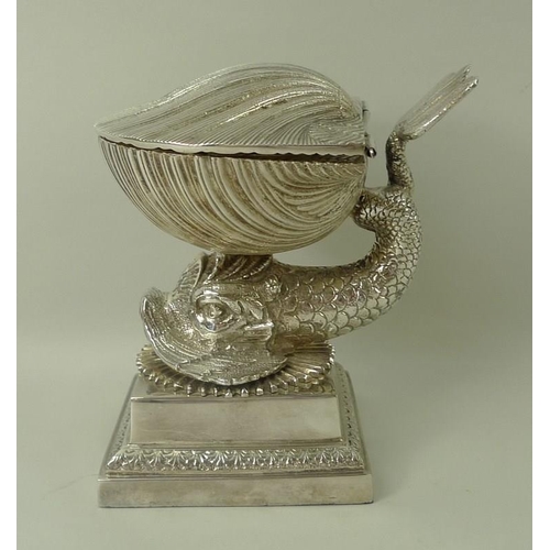 728 - An Italian silver plated desk set, 20th century, modelled as a dolphin supporting a shell with a hin... 