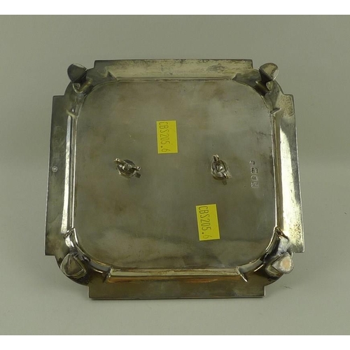 737 - A silver desk inkwell on stand, the cut glass inkwell of square form with silver lid, the stand with... 