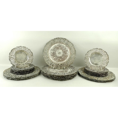 741 - A set of silver plated on copper plates or dishes, early to mid 20th century, with pierced rim appli... 