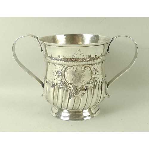 746 - A George III silver porringer two handled cup, the baluster body decorated with a rope twist girdle,... 