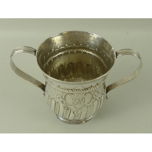 746 - A George III silver porringer two handled cup, the baluster body decorated with a rope twist girdle,... 