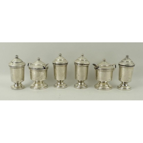 748 - A George VI silver cruet condiment set, in Art Deco style, comprising two salt shakers, two pepperet... 