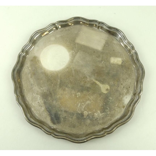 754 - A silver salver, 20th century, with Chippendale pie crust edge, raised on four scroll feet, B&W Ltd,... 