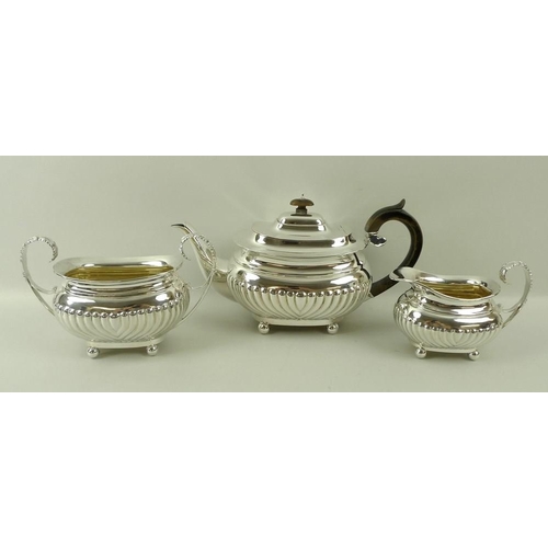 757 - A Victorian silver three piece tea set, London shape with reeded bodies, reeded and leaf scroll hand... 