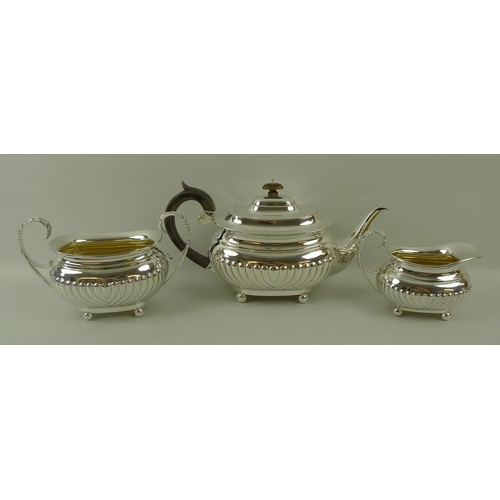 757 - A Victorian silver three piece tea set, London shape with reeded bodies, reeded and leaf scroll hand... 